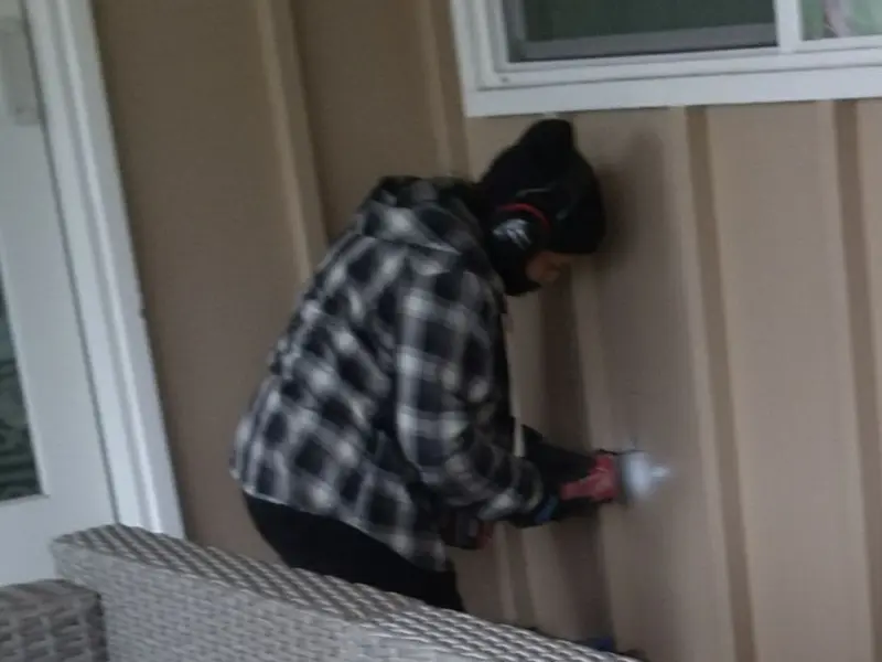 Professional electrician installing an exterior outlet in Battle Ground